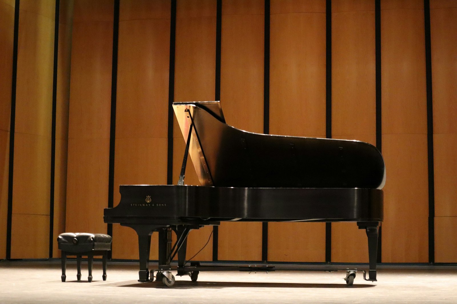 A grand piano in a recital hall; atmospheric image, not the confirmed festival venue